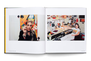An open book displays two color photographs. The photo on the left, from 1998, is a portrait of a blonde woman in a fur collar holding a cigarette in front of a large painting of the Queen of Spades. The photo on the right, from 1996, shows a person relaxing at a cluttered desk with a vintage Macintosh computer.