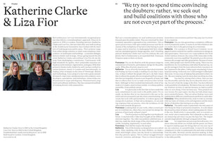 A two-page magazine spread featuring an article about architects Katherine Clarke and Liza Fior. The left page includes a photograph of the two women in a studio setting, next to columns of text. The right page continues the article, which is in an interview format, and is headed by a large pull quote.