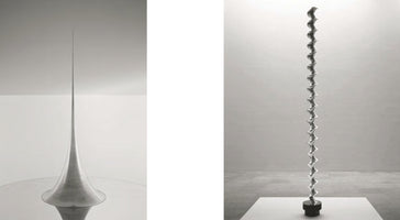 A diptych of two tall, slender, metallic sculptures in minimalist settings. On the left, a sculpture with a wide conical base tapers into an extremely fine, needle-like point reaching the ceiling. On the right, a tall, twisting column with a rhythmic, undulating form stands on a short, black base in a gallery space.