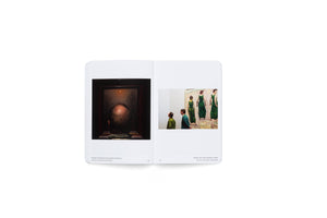 An open book lies flat, displaying a two-page spread from the series PEOPLE MATCHING ARTWORKS. On the left page, a photograph shows the back of a person looking at a dark, moody landscape painting by Friedrich. On the right page, two men in green shirts observe a painting by Hodler of three women in long green dresses, with the men's clothing matching the colors in the artwork.