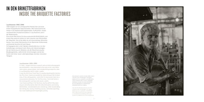 A two-page book spread titled Inside the Briquette Factories. The page on the left has text in German and English. The page on the right features a stark black-and-white photograph of a young male factory worker, his face and arms covered in dark dust, looking directly at the camera from within an industrial facility.