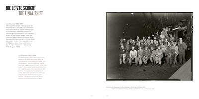 A two-page book spread titled THE FINAL SHIFT. On the left is explanatory text in German and English. On the right is a large, black-and-white photograph from 1993 showing a group portrait of dozens of workers, men and women in hard hats and workwear, posing inside a German briquette factory on their final shift before its shutdown.