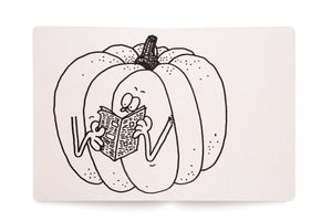 A black and white line drawing of a cartoon pumpkin with a face and arms. The pumpkin has a surprised expression as it sits and reads a newspaper. The drawing is on a page of a sketchbook set against a white background.