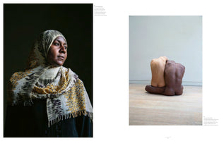 A two-page magazine spread. On the left is a dramatic, side-lit portrait of a Black woman wearing a patterned hijab against a dark background, looking off to the right. On the right is a photograph of a sculpture of two headless and armless torsos, one light-skinned and one dark-skinned, sitting back-to-back on a wooden floor.