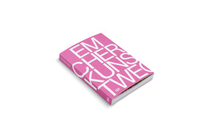 A thick book with a vibrant pink cover displayed at an angle on a white background. The title, Emscherkunstweg, is printed in a large, bold, white font and split across four lines, dominating the cover. The spine is also visible.
