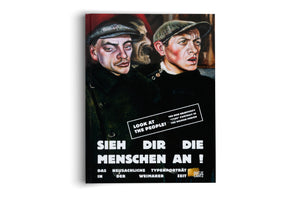 The cover of an art book titled Sieh dir die Menschen an! featuring a painting in the New Objectivity style. The painting shows the portraits of two working-class men in caps against a dark, reddish background. One man looks directly at the viewer with a stern expression, while the other looks away with his mouth slightly open in apprehension.
