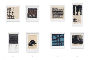 An art catalog page displays eight framed abstract textile artworks in two rows of four against a white background. The weavings feature geometric and linear patterns in mostly black, cream, and brown, with varied textures from flat to shaggy. One piece in the bottom row features a blue and black grid design.