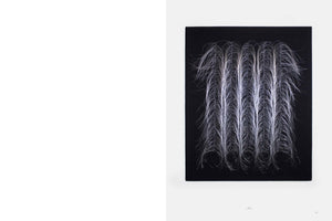 A photograph from an art book showing a square textile artwork on the right-hand page. The piece, set against a black background, features five vertical columns of fine, silvery-white, hair-like fibers that cascade downwards in a fountain-like pattern, with the ends curling up into delicate loops at the bottom.