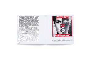 An open book on a white surface. The left page contains German text. On the right page is Barbara Kruger's 1989 artwork, Untitled (Your body is a battleground). It features a black-and-white photograph of a woman's face, split down the center. The left side is a positive image, while the right is a negative. The phrase Your body is a battleground is overlaid in white text on red rectangular blocks.