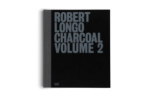 A black hardcover book titled Robert Longo Charcoal Volume 2 is shown standing upright against a white background. The title is printed in a large, bold, grey font. The book has a grey cloth spine, and the publisher's name, Hatje Cantz, is visible at the bottom left corner.