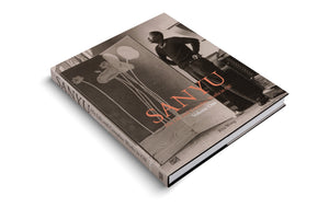A hardcover art book titled SANYU, His Life and Complete Works in Oil, Volume One by Rita Wong, shown at an angle on a white background. The sepia-toned dust jacket features a collage with a black and white photograph of the artist and one of his floral paintings.