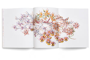 A studio shot of an open art book laid flat against a white background. The book displays a full-spread, detailed watercolor illustration of fantastical, hybrid flora. The intricate composition features a colorful array of imaginary flowers and plants with complex patterns and forms in shades of pink, orange, purple, and yellow, blending botanical and surreal elements.