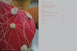 A page from an art book or catalog. On the left is a close-up photograph of a contemporary woven sculpture, which is red and spherical with small, cream-colored woven nodes on its surface where thin reeds radiate outwards. On the right side, against a plain grey background, is the table of contents for the book, showing chapter titles and page numbers in a reddish-brown serif font.