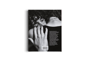 The back cover of a book set against a white background. The cover features a striking black-and-white photograph of a person with dark, curly hair, viewed from behind. A hand gently rests on their shoulder, near a tattoo on their neck that reads BE BRAVE. A block of German text and a barcode are visible on the right side.