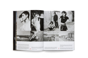 An overhead view of an open book displaying a two-page spread. The pages feature a collage of black and white photographs with German captions below. The images show a variety of scenes, including intimate portraits of young people, a group standing by a metal fence, a person doing a backflip on a court, an industrial landscape, and a concrete apartment building.
