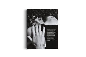 The back cover of a book, shown against a plain white background. The cover features a black and white photograph of the back of a person with dark, curly hair. A hand rests on their shoulder, and a tattoo on the nape of their neck reads BE BRAVE. A paragraph of text and a barcode are on the right side and bottom of the cover.