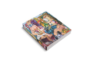 A three-quarter view of the art book Eva Beresin Thick Air: The Wedding of Humor and Horror. The book lies on a white background, its cover featuring a colorful and chaotic expressionist painting of various figures.