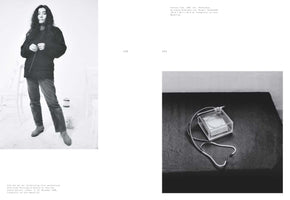 A black-and-white two-page spread from a book. On the left, page 142, is a full-length photo of Yoko Ono wearing a dark sweater and jeans in a white gallery space. On the right, page 143, is a close-up of her artwork Eternal Time, showing a clock inside a clear box with a stethoscope attached to it, resting on a dark surface. Both pages have German text captions.