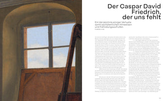 A book spread featuring an article about the artist Caspar David Friedrich. On the left is a close-up of an oil painting showing an easel in a room next to an arched window with a view of a cloudy blue sky. The right page features the article in German with the large headline: Der Caspar David Friedrich, der uns fehlt.