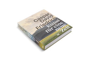 A hardcover book titled Caspar David Friedrich, Kunst für eine neue Zeit, shown at an angle on a white background. The cover features a landscape painting of a vast, cloudy sky over dark mountains and a green meadow. The publisher's name, Hatje Cantz, is visible.