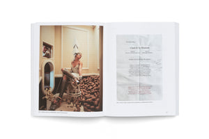 An open book laid flat on a white surface, displaying a two-page spread. The left page features a photograph of a woman in a silver dress and elaborate leg prosthetics, sitting on a high stool in a room next to a large pile of potatoes. The right page shows a photocopied sheet with the lyrics to the song Climb Ev'ry Mountain. Captions below both images identify them as artworks by Matthew Barney and Robert Gober respectively.