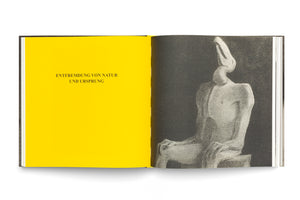An open book viewed from above against a white background. The left page is a solid, vibrant yellow with the German text Entfremdung von Natur und Ursprung. The right page features a grainy, black-and-white illustration of a stylized, seated figure with an elongated, featureless head against a dark backdrop.