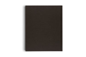 A top-down view of a plain, dark brown hardcover book lying on a white background, showing the back cover and spine with a soft shadow cast to the left.