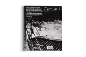 The back cover of a book from the Deutsche Kinemathek, displayed on a white background. The cover features a large black-and-white photograph of what appears to be a film set, showing wooden scaffolding in front of a painted backdrop of a snowy mountain range under a starry sky. A block of German text is at the top, and a logo and barcode are at the bottom.