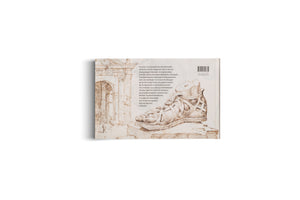 The back cover of a book shown at an angle on a white background. The cover features sepia ink drawings of a Roman arch on the left and a detailed Roman sandal on the right, with a block of German text and a barcode between them.
