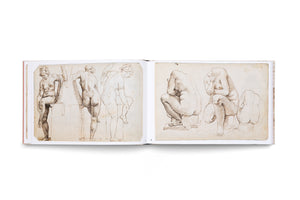 An open art book displaying two pages of classical figure studies in brown ink on aged paper, set against a white background. The left page shows sketches of a female nude in standing and seated poses. The right page contains studies of muscular, crouching nude figures.