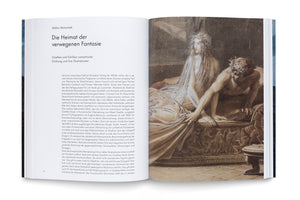 An overhead shot of an open book. The left page contains German text by author Stefan Matuschek. The right page features a full-page, sepia-toned romantic illustration of a pale, distressed woman in a translucent gown sitting beside a muscular man with a laurel wreath who is slumping over the edge of a couch.