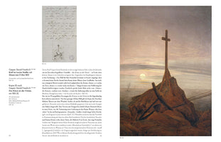 A two-page spread from an art book comparing two works by Caspar David Friedrich. The left page shows a handwritten letter with a small ink sketch of a cross on a shoreline. The right page features the finished oil painting, The Cross on the Baltic Sea, which depicts a large wooden cross on a rocky coast against a muted sky with a pale sun over the water.
