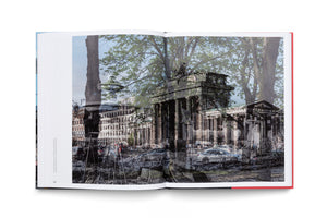 An open book laid flat on a white surface, displaying a two-page composite photograph. The image artistically blends a historic, grainy, black-and-white photo of a damaged classical monument, likely the Brandenburg Gate, with a contemporary color photo of a city street with lush green trees, buildings, and cars, juxtaposing past and present.