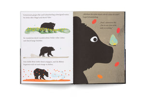An open children's book with German text shows a two-page spread. On the left, three panels depict a black bear and a butterfly walking through a flower field, a barren land, and among falling autumn leaves. The right page is a large close-up of the bear's face with the butterfly on its nose.