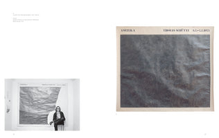 A two-page spread from an art book. On the left is a black-and-white photograph of artist Thomas Schütte in 1975, sitting in front of his large-scale artwork. On the right is a full-color detail shot of the artwork, titled Amerika, showing a heavily worked surface of dark gray pencil on crumpled paper.