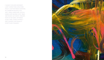 An open art book spread with a quote on the left page and a painting on the right. The right page is a close-up of a vibrant, abstract painting with energetic, textured brushstrokes in yellow, pink, and orange layered over a deep blue background.