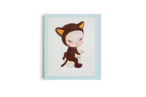 A light blue hardcover journal is shown vertically on a white background. Its cover features an illustration of a child with a grumpy expression wearing a brown cat costume and holding a small white toy duck.