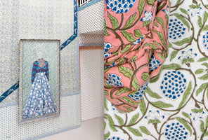 A two-panel image displaying a variety of floral block-printed textiles. On the left, a dress with a blue and white patterned skirt is displayed in a wall niche within a room covered in fabric with a smaller blue and green floral pattern. The right panel is a close-up of a draped salmon-pink fabric with large blue flowers and green leaves, set against a white fabric with a similar design.