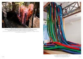 A two-page book spread displays two distinct art installations. On the left, an outdoor installation from 1977-1987 shows shredded and dyed pink and red fabric hanging like a waterfall in a dark stone courtyard. On the right, a 2010 gallery installation features numerous thick, colorful, fabric-wrapped tubes cascading from an upper-level balcony and piling onto the floor.