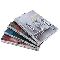 Stack of art books on a white background