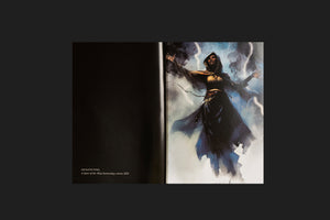 An open book displays a full-page illustration on the right side. The painting shows a powerful woman with dark skin wearing a black, hooded robe, her arms outstretched as she summons a storm. Bolts of lightning crackle around her amidst dark, swirling clouds. The left page is black with text identifying the artist, Abuqadim Haqq, and the title, A Sister of the Abyss harnessing a storm, 2023.