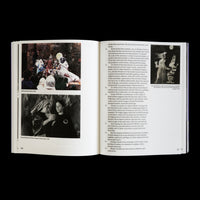 An open art book displaying a two-page spread about artist Meredith Monk. The left page features two stills from her 1988 film, Book of Days. The right page contains numbered paragraphs of text analyzing her work, alongside a small, dreamlike black and white image from her 1972 piece, Education of the Girlchild.