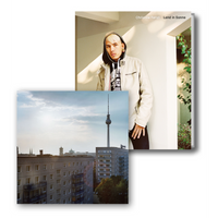 The cover for the book Land in Sonne by Christine Fenzl, featuring a portrait of a young person, is shown overlapping a photograph of the Berlin skyline.