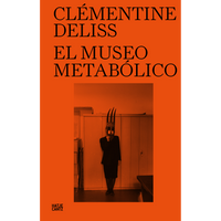 The cover of the book El Museo Metabólico by Clémentine Deliss, featuring a bright orange background and a central photograph of a person in a dark suit wearing an elaborate three-pronged mask.