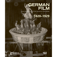 The cover of the book German Film 1920-1929, showing a vintage, sepia-toned photograph of a costumed performer posing on a large, ornate film prop held by several crew members.