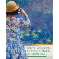 A woman from behind in a blue floral dress and a tan hat photographs a large blue impressionist painting that matches her clothing.
