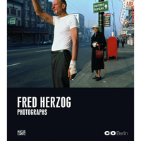 The cover of the book Fred Herzog Photographs, showing a man with a bandaged hand raising his arm on a city street while an older person stands on the sidewalk.