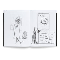 An open book with black, sketchy illustrations on its pages. The left page has a tall, abstract figure with large eyes. The right page shows a cartoon banana character next to two boxes of handwritten text. The top box reads: SOME-TIME I FEEL SO HAPPY. The bottom box reads: THOUGHT OF YOU AS EVERYTHING I'VE HAD BUT COULDN'T KEEP.