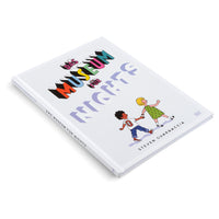 A white hardcover book, Das Museum für Nichts by Steven Guarnaccia, is displayed at an angle on a white surface. The cover features the title in colorful, 3D block letters above a cartoon illustration of a young Black boy and a blonde girl holding hands as they walk.