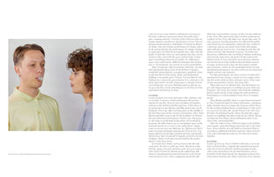 A page from a book featuring a photo and two columns of text. The photo shows a man in a yellow polo shirt and a woman with curly hair facing each other in profile against a white background. The man holds a clear, bubble-like object between his lips as they gaze at one another. A caption identifies them as Anton Vikhrov and Pau Holtkamp performing.